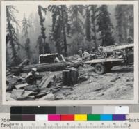 Redwood Region. Salvaging split products from refuse on Fred Lundblade's Press Estate property on Salmon Creek near Beatrice. All Mexican labor. $1.50/hr. (see also #7499). Square pile is for Hollywood shakes. 9-7-50. E.F