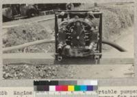 Engine side of the small portable pumper which slips apart from the pumps for carrying. W. Metcalf - May 1931