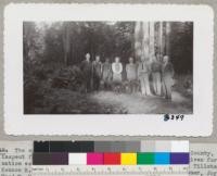 The special committee which met at Joy Woods, Sonoma County, to inspect forestry practices, November 1945. Approval was given for designation as a "Tree Farm." Left to Right, E. Fritz, C. R. Tillotson, Kennon R. Gilbert, Sonoma Planning Comm., Anita Laton, Owner, Joy Woods, Fred W. Mann, Secretary, Sonoma County Planning Committee, Harry Sheldon, District Conservator, Soil Conservation Service [?], Sebastopol, Stewart Snyder, Manager, Joy Woods, Wade Sturgeon, Sawmill Operator, Sebastopol. Metcalf 1945