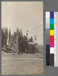 A package of lumber en route to the yards 5-3/8 miles away. An empty "sling" shown on the return side. Spanish Peak Lumber Company, Quincy, California. August, 1920. E.F