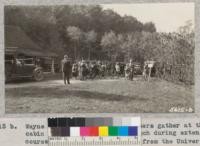 Wayne County rural school teachers gather at the cabin in Saginaw Forest for lunch during extension course in forestry by teachers from the University of Michigan. 1932