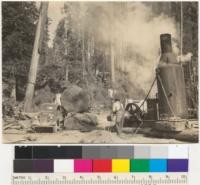 Redwood. Loading an 8' log to a Ford truck. Klamath-California Lumber Company operation near Klamath, California. Frank Fraser's contract. See also 6435-9. 8-16-37. E.F