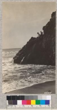 Rocky cliffs on the north end of Point Sal Beach are inaccessible at high tide, but at low water, one can go around them to small coves beyond. Metcalf. November, 1928