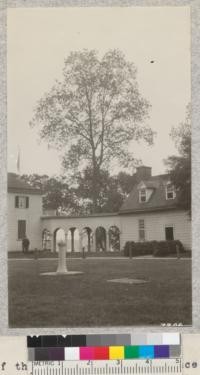 Angle of the Mount Vernon residence with the kitchen on the right and dinig room left. The big pecan hickory in the background is protected from lightning by a lightning rod. Lantern slide made