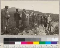 Forest Supervisor Elliott showing some chaparral-covered watersheds to the Orange County Farm Bureau Forestry Tour. Nov. 1927. Metcalf