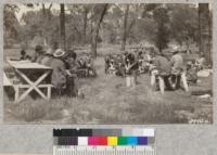 This fire warden's conference near Oroville, Butte County, May, 1930. Fairbank talks on the Indian knapsack pump