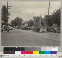 Camp Califorest. Forestry float in Quincy's 4th of July parade. A miniature log house on a truck. July 4, 1939. Emanuel Fritz