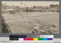 Concrete bridge over San Diego River north of San Diego destroyed by the flood of February, 1916, San Diego County, California. Practically all of the bridges of whatever construction between Santa Ana and the Mexican line were carried out in the high water of 1916. Further up this river 10 miles of railway was completely destroyed. May, 1916