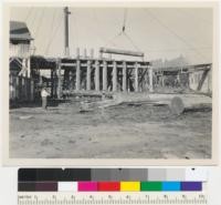 Redwood Region. Loading logs from cold deck to mill floor at Sage Land and Improvement Company mill at Willits, California. See also 7247. 9-30-43. E.F