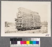 Red River Lumber Company, Westwood, California. Flat car loaded with packages of lumber on road to yard for piling