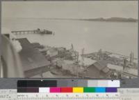 View from top of new concrete burner. Showing log booms and cargo wharf. Holmes-Eureka Lumber Company, Eureka, California. May, 1920. E.F