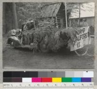 Camp Califorest. Forestry float in Quincy's 4th of July parade. A miniature log house on a truck. July 4, 1939. Emanuel Fritz