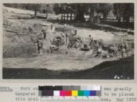 Work on Whitaker's swimming pool was greatly hampered by spring water which had to be placed in tile drains before work could proceed. May 1935. William Haas, foreman of Civilian Conservation Corps crew from Maxon Ranch