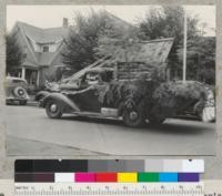 Camp Califorest. Forestry float in Quincy's 4th of July parade. A miniature log house on a truck. July 4, 1939. Emanuel Fritz