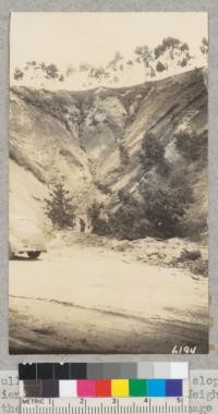 Gulley erosion of this steep slope above Hacienda Drive near La Habra Heights covered the road and caused much damage below. March 1938. Metcalf