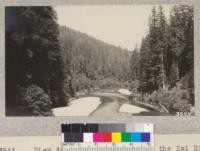 View down the South Fork of the Eel River from the new suspension bridge near Miranda. The bridge has opened the timber on the north side of the river to "split stuff" operations and considerable cutting is going on. 1925