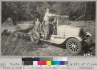 Santa Cruz 4-H Club members log a bit of firewood with a Model T. at Camp Loma. 1937. Metcalf