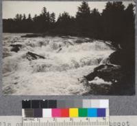 Falls on East Branch of Penobscot River, Maine. Large drives of logs and pulpwood go over these falls each year with more or less brooming of the wood. D. T. Mason '19