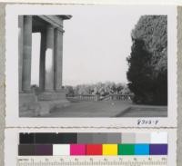 Stone Pergola and view house looking west to the Rockies from Denver City Park. Juniper at right