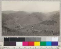 View over watershed of upper San Leandro Canyon, January, 1925. Redwood school shown in the middle distance will be in the bottom of the new lake