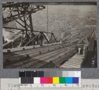 Views looking down log elevator plant of St. Maurice Lumber Co. Three Rivers, Quebec