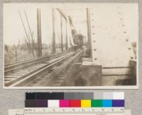 American railroad ditcher working as a pile driver