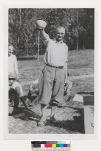 Memoriam section (obit) Malmsten (?) left side. This is A. W. Sampson, horseshoe expert. Horseshoe in left hand, championship in right. Ca. 1928