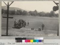 The set-up for fire protection demonstration in Strathmore - 1940. Discussing fire causes and common hazards. Metcalf