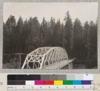 A series of 8 views (#4636-4643) of tops of trees of Dyerville Flat, Redwood Highway. Taken from high bank above road at north end of new bridge over South Fork Eel River near its mouth. E. F. July 17, 1932