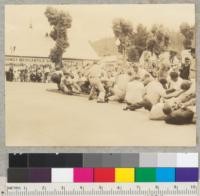 Camp Califorest. Tug-of-war contest on Main St. in Quincy, California. 4th of July celebration. Foresters to right. Lost contest. 7-4-39. E.F