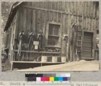 South end of Club House, Camp Califorest. Fire tool racks. June 1936, E.F