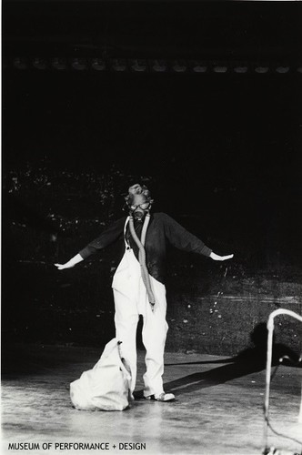 Performer wearing a gas mask in Anna Halprin's "Parades and Changes"