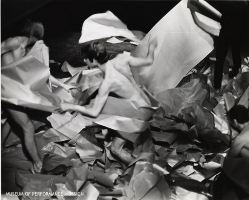 Three male performers in "Paper Dance" from Halprin's "Parades and Changes" [includes partial nudity]