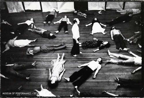 Male performer standing with other performers around him in Halprin's "Circle the Earth"