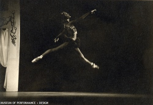 Female dancer mid jump in Christensen's "Le Gourmand"