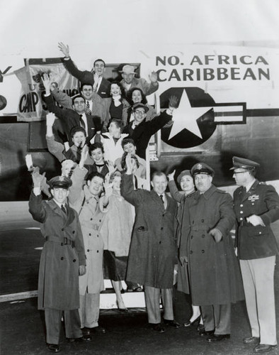 North Africa Caribbean USO troupe departs after a Camp Show Christmas Special, 1955