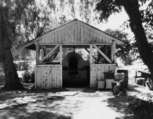 Restored bake oven behind the Leonis Adobe