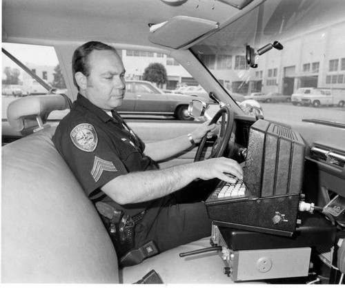 Field Accessible Computer Terminal System (FACTS) in Glendale police car, Glendale, 1977