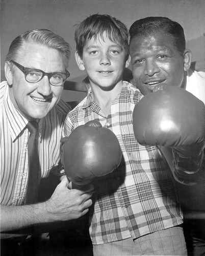 Congressman James C. Corman and boxer Sugar Ray Robinson at the Pacoima Boys Club, Pacoima, circa 1970