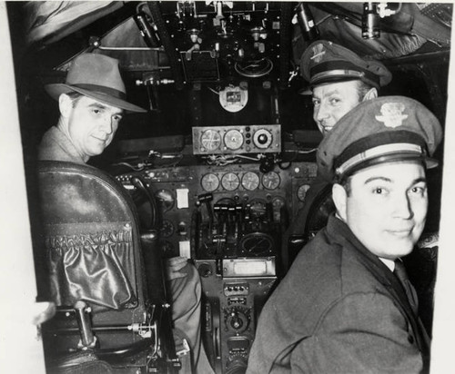 Howard Hughes and crew in Cockpit of one of TWA's Lockheed L-749 Constellations. ca. 1946