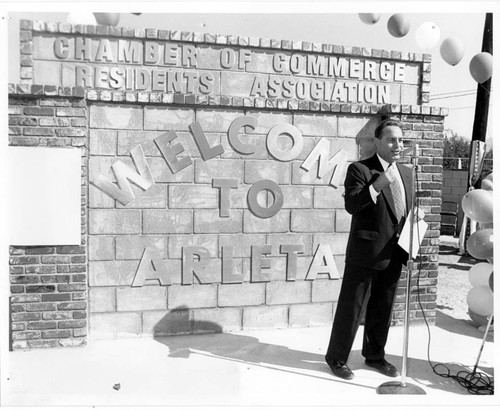 Los Angeles City Council member Joel Wachs in front of "Welcome to Arleta" sign, Arleta, 1994