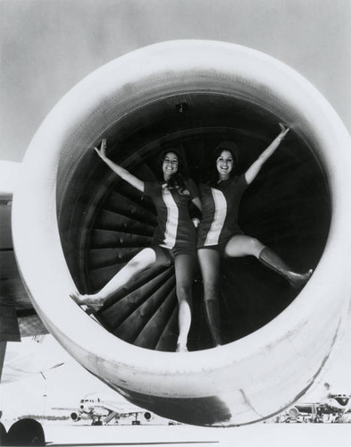 Pacific Southwest Airlines stewardesses pose for publicity pictures in an L-1011 Tri-Star engine