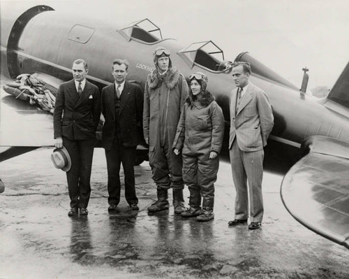 Charles A. Lindbergh and his co-pilot/navigator, Anne Lindbergh beside their Sirius