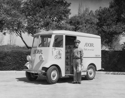 Adohr Farms delivery truck with a milkman, circa 1936