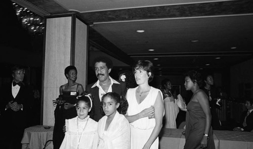 Richard Pryor posing with Jennifer Lee and his daughters, Los Angeles, 1978