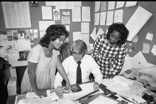 Community Redevelopment Agency staff looking at paperwork, Los Angeles