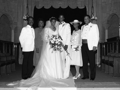 Darryl Strawberry and Lisa Andrews posing with family at their wedding, Pasadena, 1985