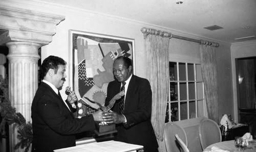 Tom Bradley receiving an award at an event for supporters of the "Lou Rawls Parade of Stars" telethon, Beverly Hills, 1990