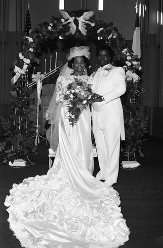 Black and Morgan wedding couple posing for their portrait, Los Angeles