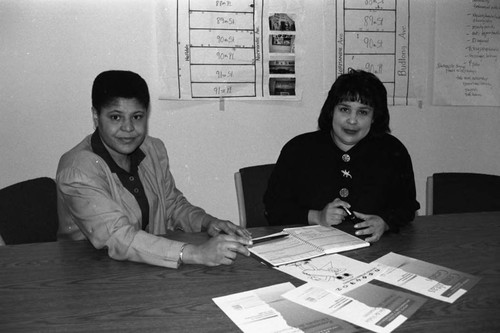 Karen Bass and an unidentied woman sitting at a table, Los Angeles, 1994